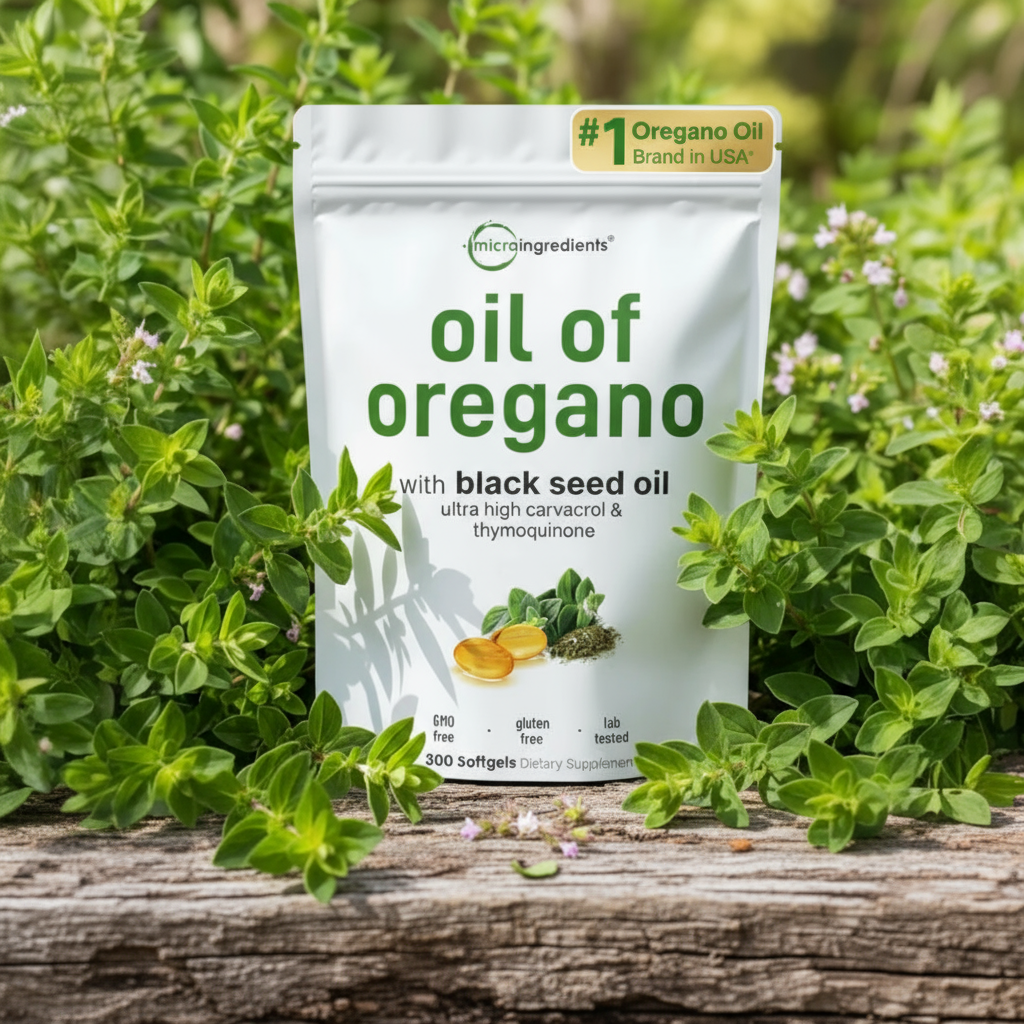Package of 'oil of oregano' with black seed oil on a wooden surface with greenery in the background